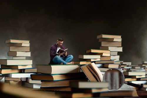 images/blogs/contentImages/little-man-reading-among-large-books-textbooks-scale-effect-gaining-knowledge-education-concept-student-studying-subject-before-exam.jpg